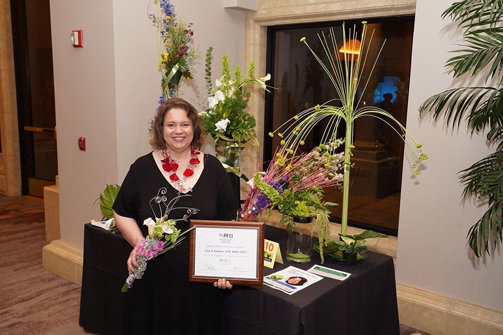 Lisa A. Greene, AAF, AIFD, PFCI, of Beach Plum Flower Shop in Newburyport, Massachusetts was named first runner-up.